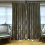 Patterned curtains and silver chairs