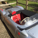 Grey car with red seats