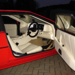 Red Lotus car with white interior