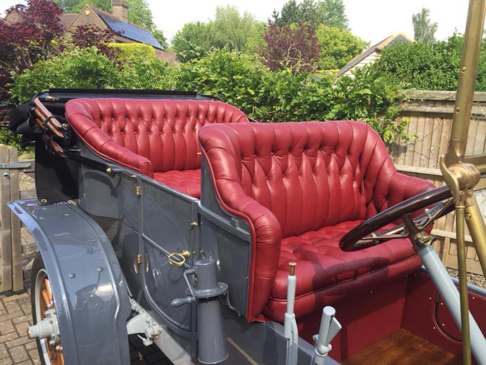 Red seats in an antique car